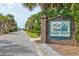 Well-maintained brick community entrance sign amid mature landscaping in a peaceful setting at 647 Norris Dr., Pawleys Island, SC 29585