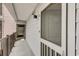 Exterior hallway with elevator access featuring door number B and coastal tones at 647 Norris Dr., Pawleys Island, SC 29585