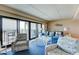 Bright living room featuring access to a private balcony and coastal decor that connects to a dining area at 647 Norris Dr., Pawleys Island, SC 29585