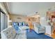 Bright living room with hardwood floors, coastal decor and direct view into the dining area and kitchen at 647 Norris Dr., Pawleys Island, SC 29585
