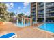 Colorful water park featuring slides and interactive features next to the main pool for Gathering enjoyment at 6900 N Ocean Blvd. # 404, Myrtle Beach, SC 29572