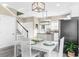 Bright kitchen with stainless steel appliances, white cabinets and dining area, ideal for culinary enthusiasts at 904 62Nd Ave. N # A, Myrtle Beach, SC 29572
