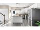 Bright kitchen features an island, stainless steel appliances, and white cabinets for a modern, clean look at 904 62Nd Ave. N # A, Myrtle Beach, SC 29572