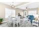 Open-concept living room seamlessly blends with dining area, creating a welcoming space for gathering and entertaining at 904 62Nd Ave. N # A, Myrtle Beach, SC 29572