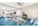 Open-concept living and dining room with hardwood floors flows into a bright, modern kitchen for effortless entertaining at 904 62Nd Ave. N # A, Myrtle Beach, SC 29572