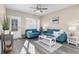 Inviting living room features neutral walls, hardwood floors, blue sofas, and natural light, perfect for relaxation and comfort at 904 62Nd Ave. N # A, Myrtle Beach, SC 29572