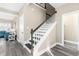 View of the home's stairway, complemented by neutral walls, modern floors, and natural light at 904 62Nd Ave. N # A, Myrtle Beach, SC 29572