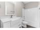 Bathroom featuring modern vanity, toilet, and bathtub, complemented by neutral tones and wood-look floors at 904 62Nd Ave. N # E, Myrtle Beach, SC 29572