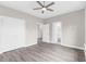 Spacious bedroom featuring modern flooring, a ceiling fan, and ensuite bathroom access at 904 62Nd Ave. N # E, Myrtle Beach, SC 29572
