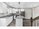 Open concept kitchen with island, granite countertops, and stainless steel appliances at 904 62Nd Ave. N # E, Myrtle Beach, SC 29572