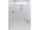 Shower featuring white marble tile, shower bench, window, and storage niche at 904 62Nd Ave. N # E, Myrtle Beach, SC 29572