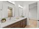 Elegant bathroom with double sinks, marble countertops, and modern fixtures, creating a luxurious experience at 9109 Sanremo Ln., Myrtle Beach, SC 29579