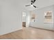 Bright bedroom with hardwood floors, ample natural light, and a view into an ensuite bathroom at 9109 Sanremo Ln., Myrtle Beach, SC 29579