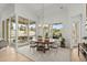 Bright dining area with large windows and sliding door leading to outdoor patio at 9109 Sanremo Ln., Myrtle Beach, SC 29579
