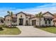 Stunning home features a tile roof, paved driveway, and a beautifully landscaped front yard at 9109 Sanremo Ln., Myrtle Beach, SC 29579