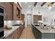 Well-equipped kitchen boasts stainless steel appliances, custom cabinetry, and open design to the living areas at 9109 Sanremo Ln., Myrtle Beach, SC 29579