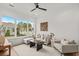 Bright living room featuring large windows, neutral tones, and stylish decor for a relaxing atmosphere at 9109 Sanremo Ln., Myrtle Beach, SC 29579