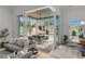 Comfortable living room with view of pool and outdoor lounge area at 9109 Sanremo Ln., Myrtle Beach, SC 29579