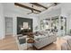 Spacious living room features modern decor, wood beams, fireplace, and seamless indoor/outdoor living at 9109 Sanremo Ln., Myrtle Beach, SC 29579