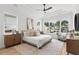 Tranquil primary bedroom with large windows offering stunning backyard views at 9109 Sanremo Ln., Myrtle Beach, SC 29579