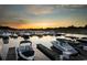 Marina view filled with boats docked at sunset, under a colorful sky at 9109 Sanremo Ln., Myrtle Beach, SC 29579