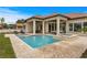 Stunning backyard pool with a spa, a waterfall feature, and a spacious patio area at 9109 Sanremo Ln., Myrtle Beach, SC 29579
