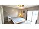 Bright bedroom with a sliding glass door, offering access to a balcony and natural light at 1100 Commons Blvd. # 606, Myrtle Beach, SC 29572