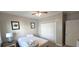 This is a simple bedroom featuring a bed, closet, ceiling fan, and neutral decor at 1100 Commons Blvd. # 606, Myrtle Beach, SC 29572