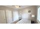 Simple bedroom featuring neutral decor, a ceiling fan, and good natural lighting at 1100 Commons Blvd. # 606, Myrtle Beach, SC 29572