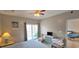 Comfortable bedroom featuring a balcony with outside seating area and a television at 1100 Commons Blvd. # 606, Myrtle Beach, SC 29572