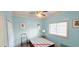 Bedroom with aqua-colored walls, ceiling fan, and closet at 1100 Commons Blvd. # 606, Myrtle Beach, SC 29572