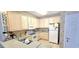 Functional kitchen with white cabinets, essential appliances, and ample counter space at 1100 Commons Blvd. # 606, Myrtle Beach, SC 29572