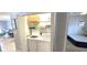 Laundry closet with stackable washer and dryer located next to bedroom at 1100 Commons Blvd. # 606, Myrtle Beach, SC 29572