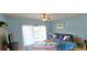 Relaxing living room features a comfortable blue sofa and ample natural light from the balcony with blue walls at 1100 Commons Blvd. # 606, Myrtle Beach, SC 29572