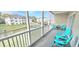 Screened patio with outdoor seating and view of the complex's landscaping at 1100 Commons Blvd. # 606, Myrtle Beach, SC 29572