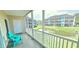 Screened patio with outdoor seating and view of the complex's landscaping at 1100 Commons Blvd. # 606, Myrtle Beach, SC 29572