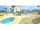 The community pool features a spa and two pools with lounge furniture in a beautiful landscape at 1100 Commons Blvd. # 606, Myrtle Beach, SC 29572