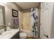 Bright bathroom with tub shower and patterned shower curtain at 1221 Tidewater Dr. # 1922, North Myrtle Beach, SC 29582