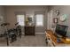 Cozy room with desk, drumset, and window lighting, ideal for music or studying at 1221 Tidewater Dr. # 1922, North Myrtle Beach, SC 29582