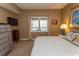 Comfortable bedroom with a large window and a dresser at 1221 Tidewater Dr. # 1922, North Myrtle Beach, SC 29582