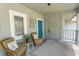 Cozy front porch with nautical accents, offering a relaxed outdoor space with comfortable wicker seating at 1221 Tidewater Dr. # 1922, North Myrtle Beach, SC 29582
