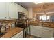 Cozy kitchen featuring stainless steel appliances, wood countertops, and an open design to the living area at 1221 Tidewater Dr. # 1922, North Myrtle Beach, SC 29582