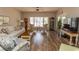 Bright living room showcasing hardwood floors and comfortable seating at 1221 Tidewater Dr. # 1922, North Myrtle Beach, SC 29582