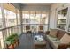 Cozy screened porch with wicker furniture, offering a relaxing outdoor living space with lovely views at 1221 Tidewater Dr. # 1922, North Myrtle Beach, SC 29582