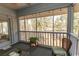Inviting screened porch overlooking nature, with seating and plants creating a serene atmosphere at 1221 Tidewater Dr. # 1922, North Myrtle Beach, SC 29582