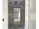 A view of the hallway shows the drywall installed and an open doorway into the next room at 1274 Pinetucky Dr., Galivants Ferry, SC 29544
