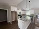 New kitchen with white cabinets, granite counters, and island, under bright lighting at 1274 Pinetucky Dr., Galivants Ferry, SC 29544
