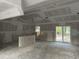 The living room has a vaulted ceiling, windows, drywall, and sliding glass doors to the outside at 1274 Pinetucky Dr., Galivants Ferry, SC 29544