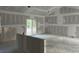 A large living room with installed drywall and sliding glass doors leading to the outside at 1274 Pinetucky Dr., Galivants Ferry, SC 29544