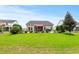 Spacious backyard featuring a well-maintained lawn and a back patio ideal for outdoor entertaining at 129 Astoria Park Loop, Conway, SC 29526